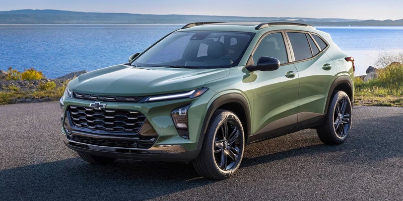 2026 Chevrolet Trax parked on a tree-lined gravel back road