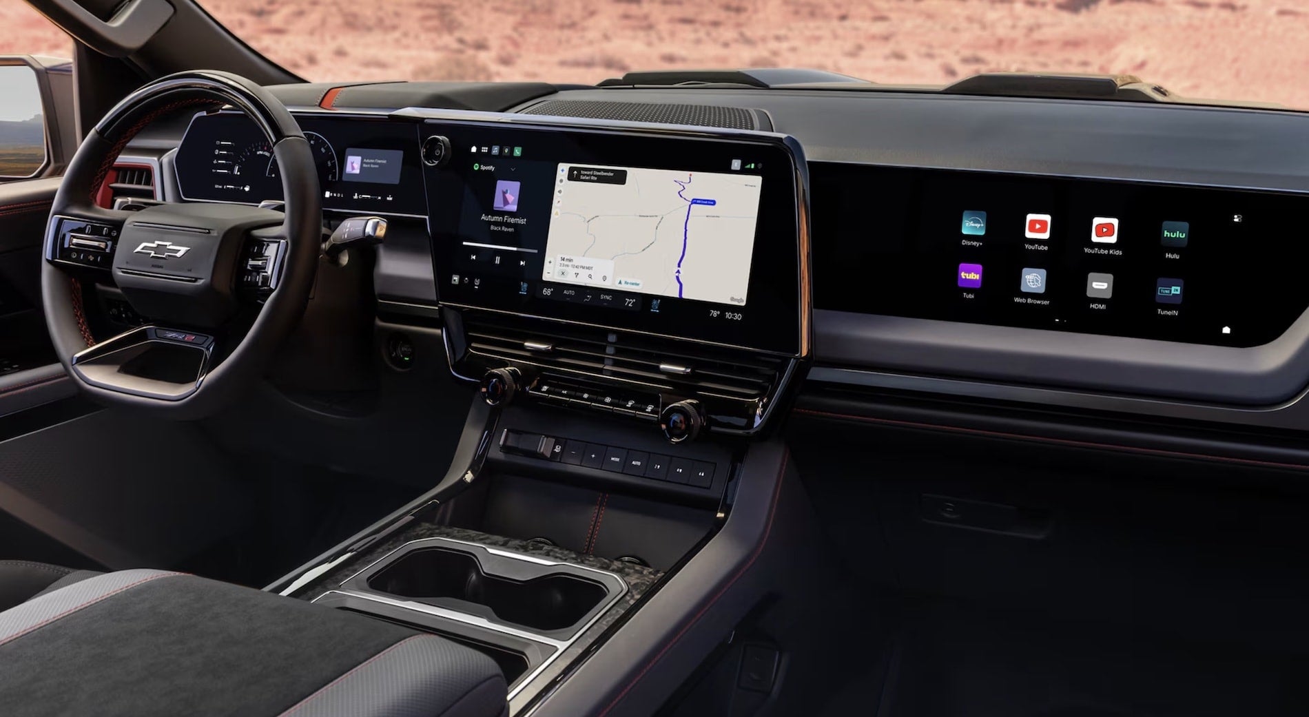 2027 Chevrolet Silverado 1500 ZR2 interior with the 16.3-inch touchscreen and Torch Red accents